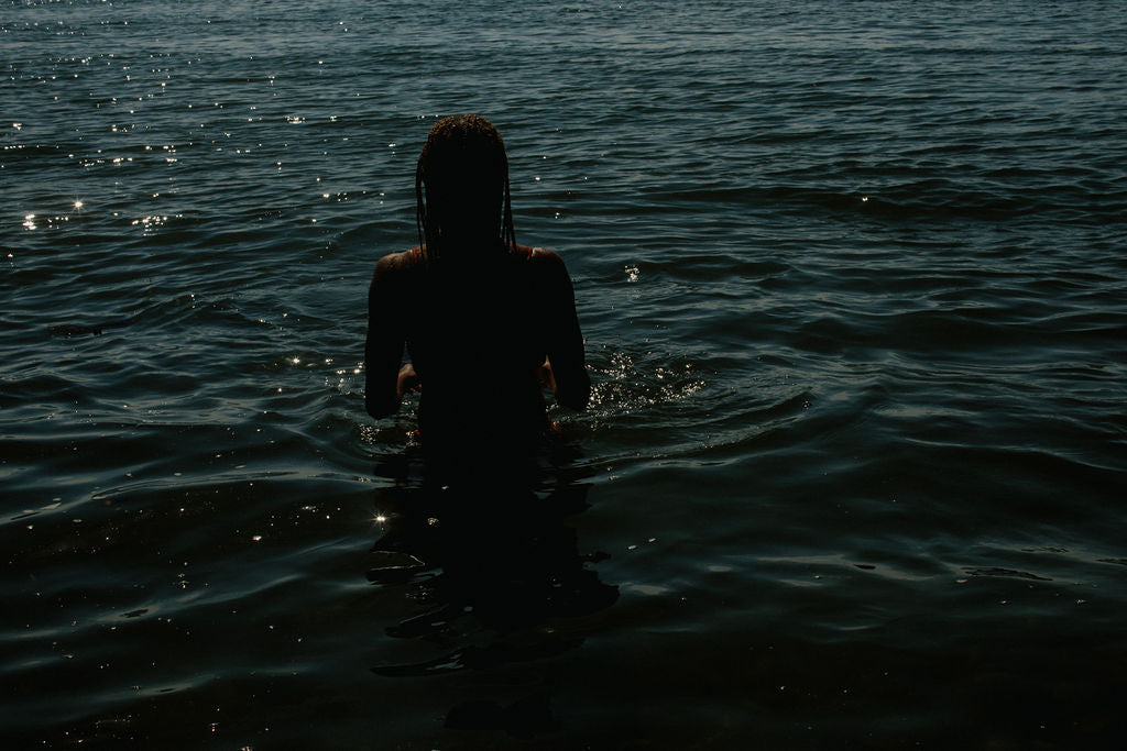 sense of touch - woman touching water around her
