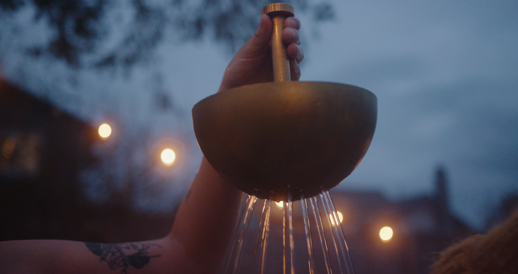 brass hand shower by GOODLAND in a photo by Hideaway Creative