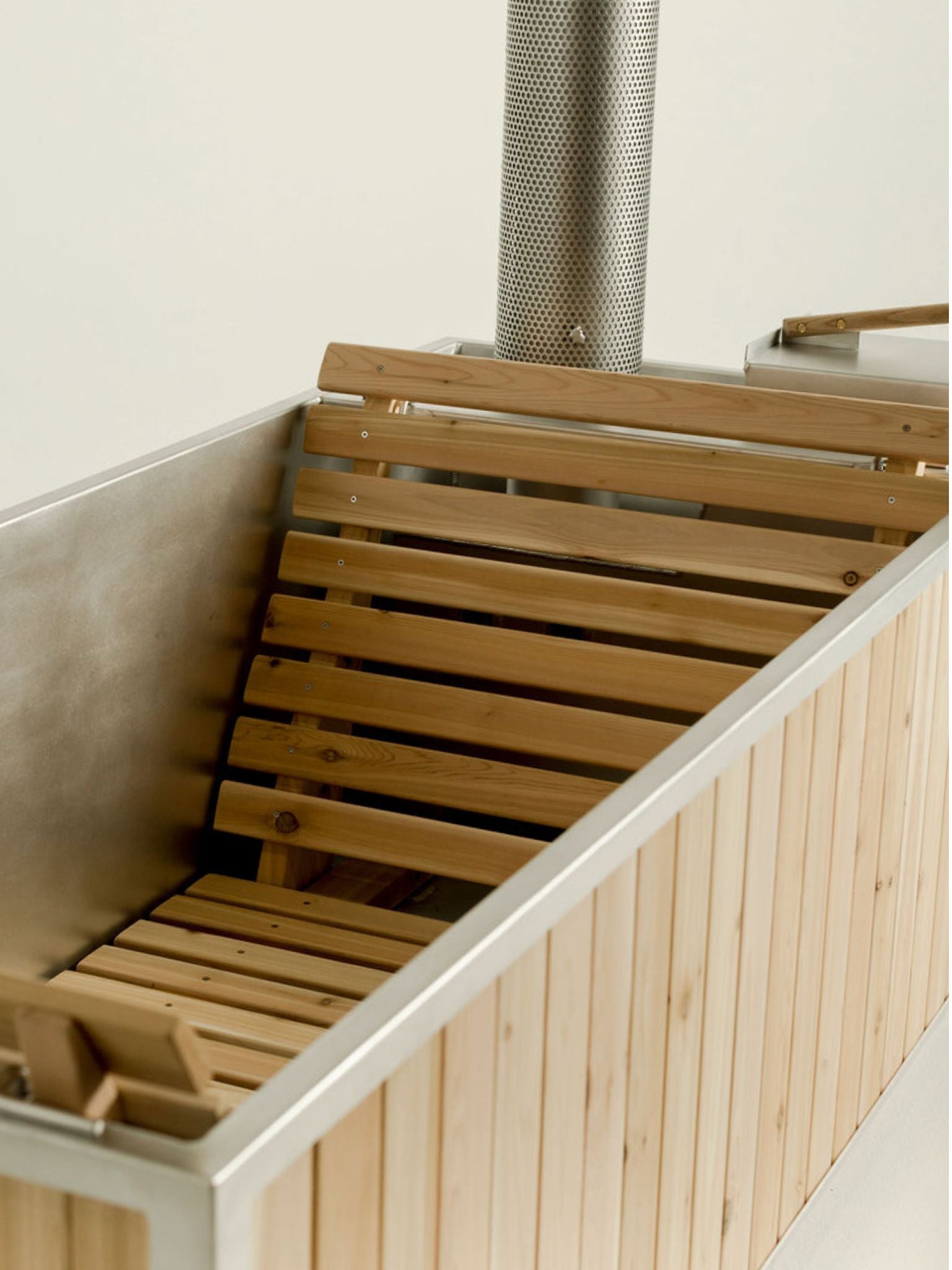 wood burning hot tub with cedar lounging seats