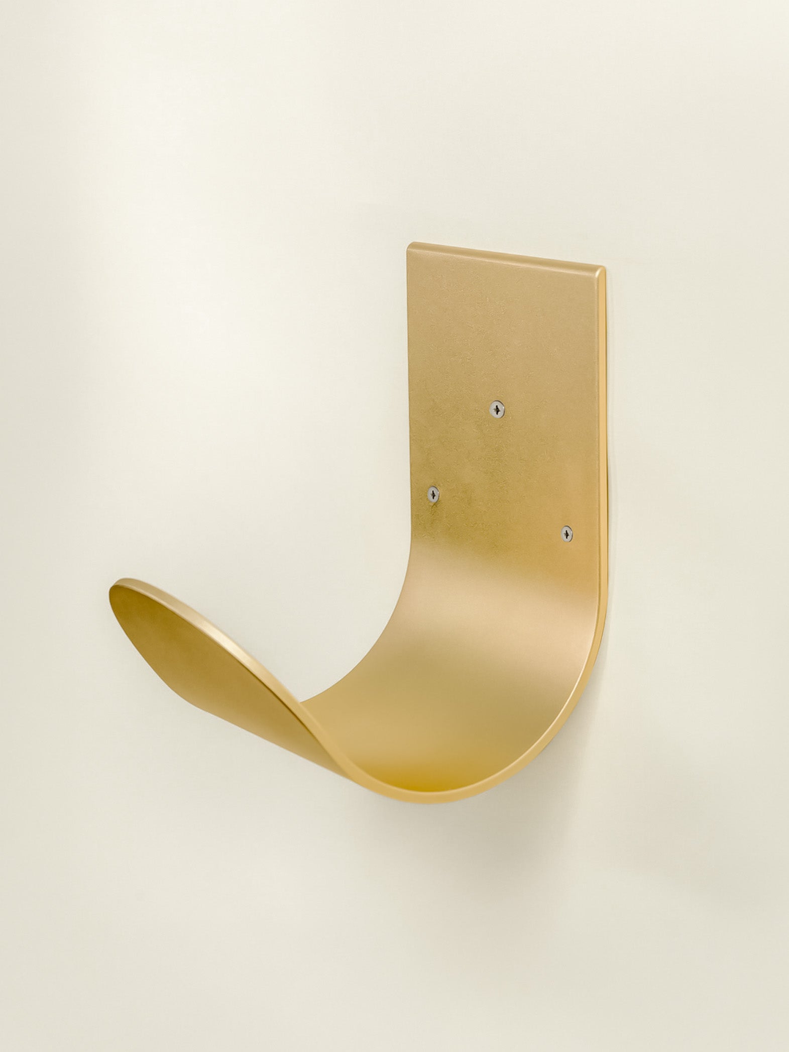 Wall mounted hose hanger in brass for garden hose