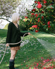 Woman using all purpose garden hose in gray