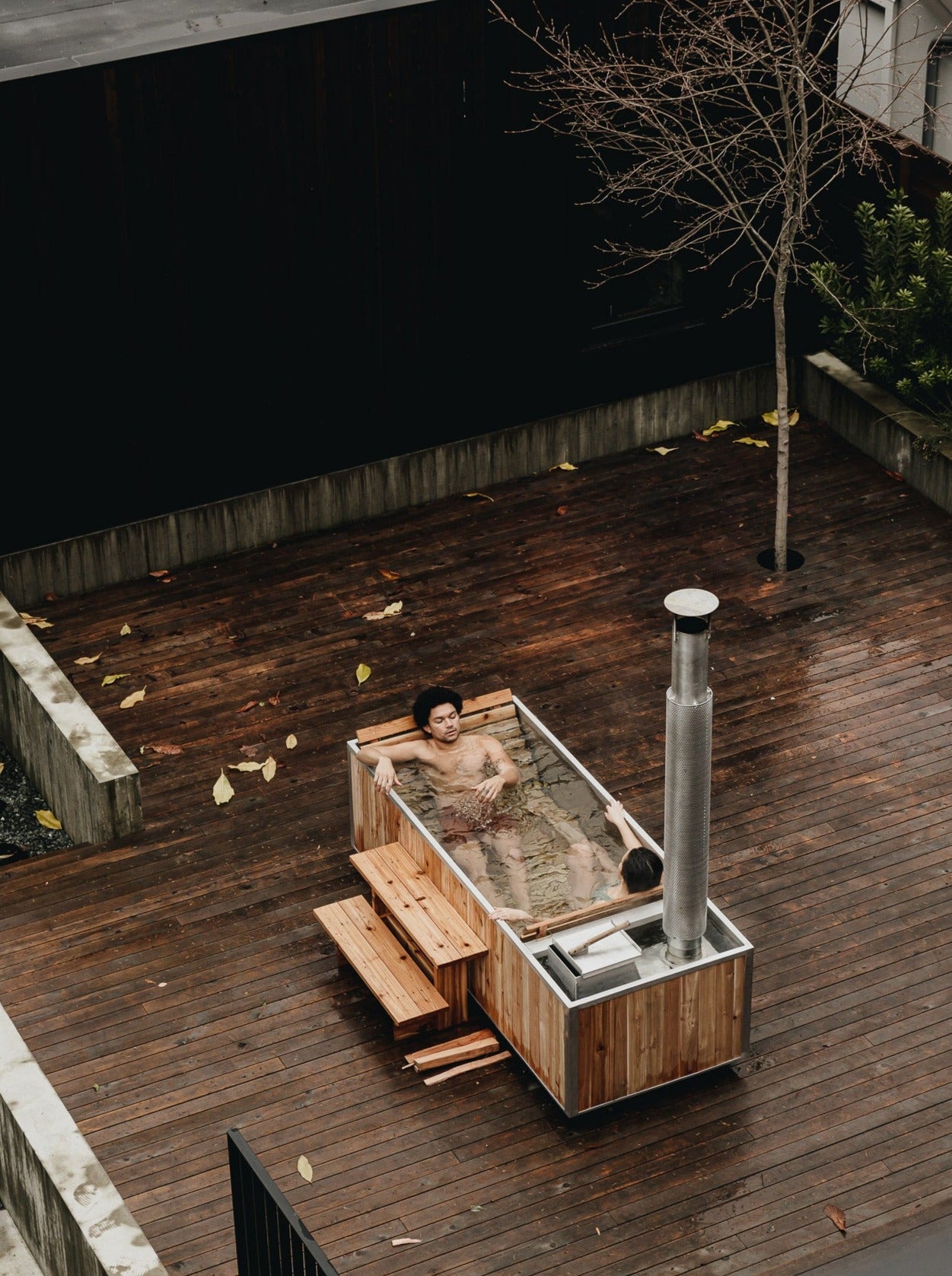 wood-burning hot tub with two people