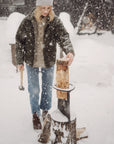 winter firewood splitter in snow