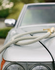 Matte green water hose on car