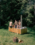 4 people in wood fired hot tub outdoors