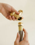 Garden hose Y splitter next to a grey garden hose