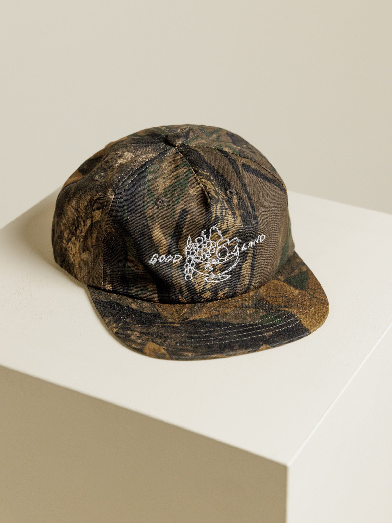 Camo baseball cap from GOODLAND with Canaan Pine illustration