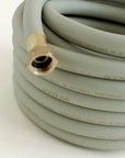 25 ft garden hose in green with close up of brass fitting