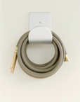 25 ft grey garden hose on aluminum wall mounted hose hanger