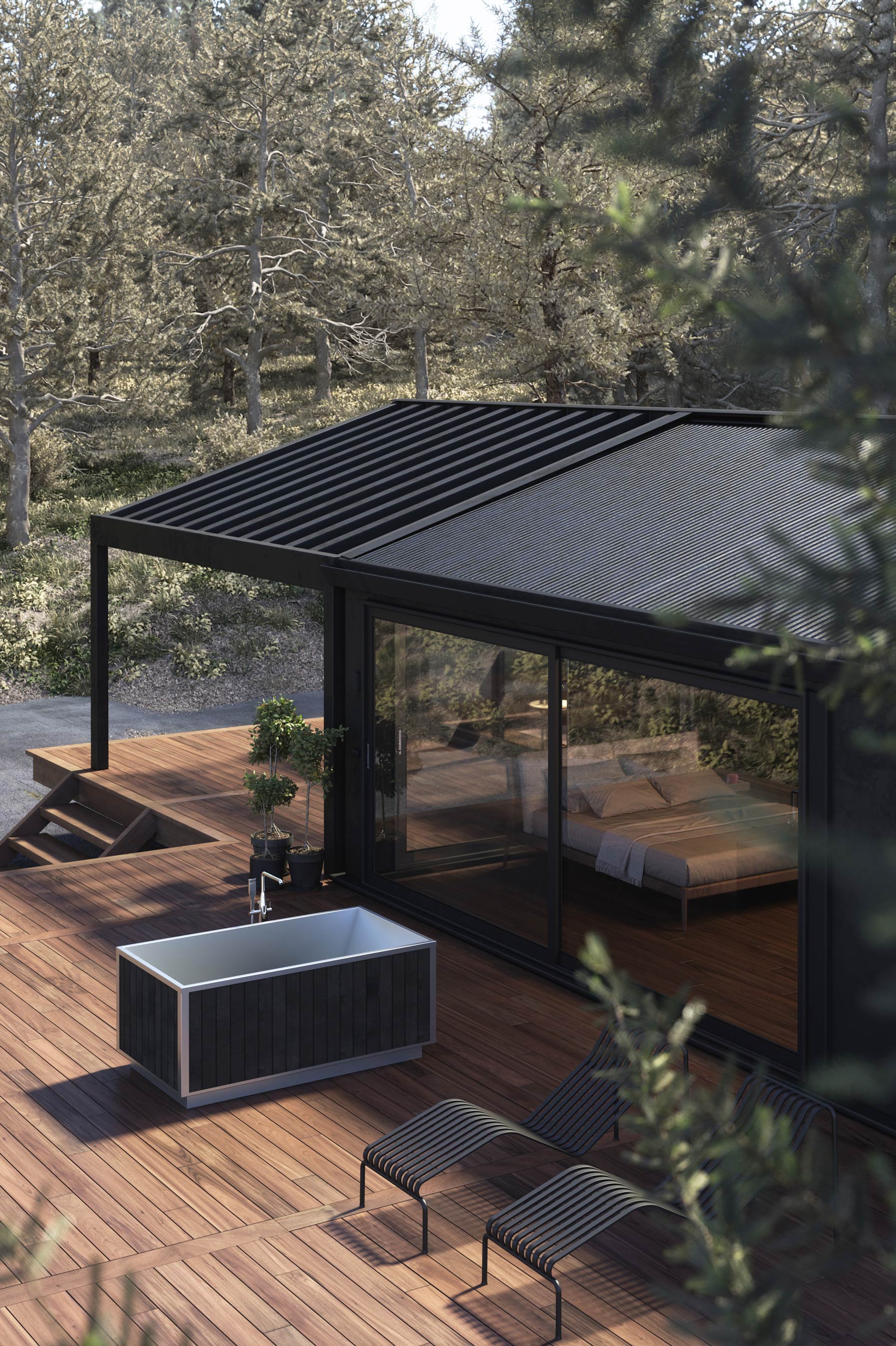 black stainless steel soaking tub beside modern home on patio