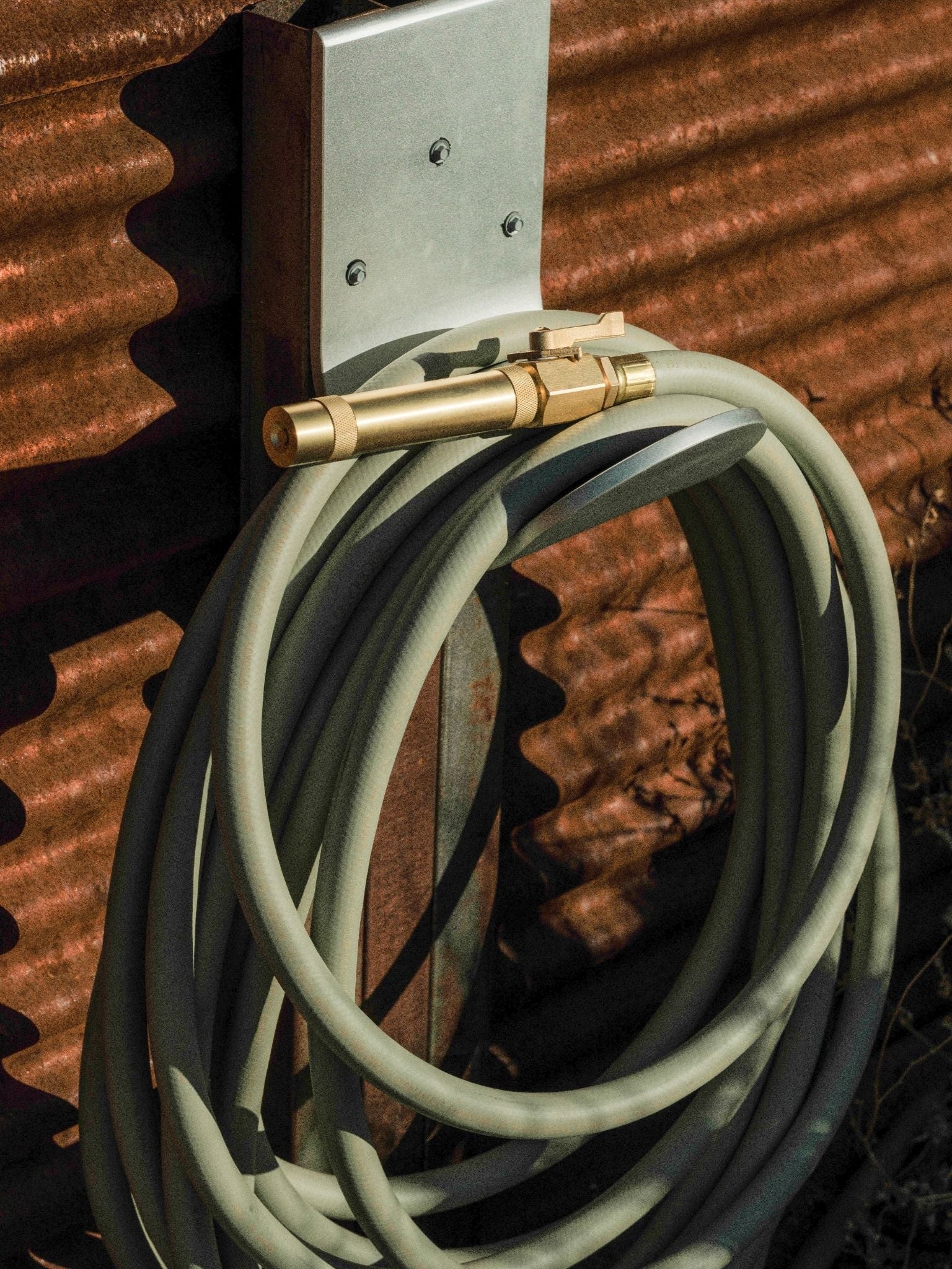 garden hose nozzle on green hose