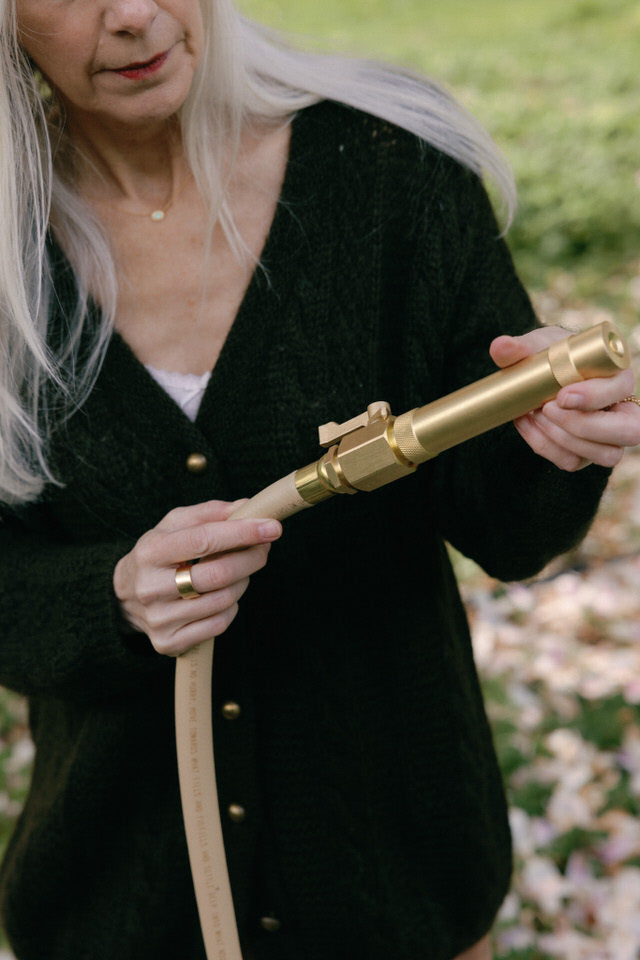 50 foot beige garden hose with brass nozzle