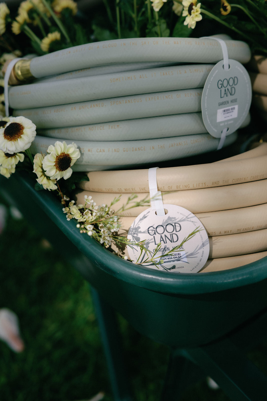 garden hoses in tan and matte green