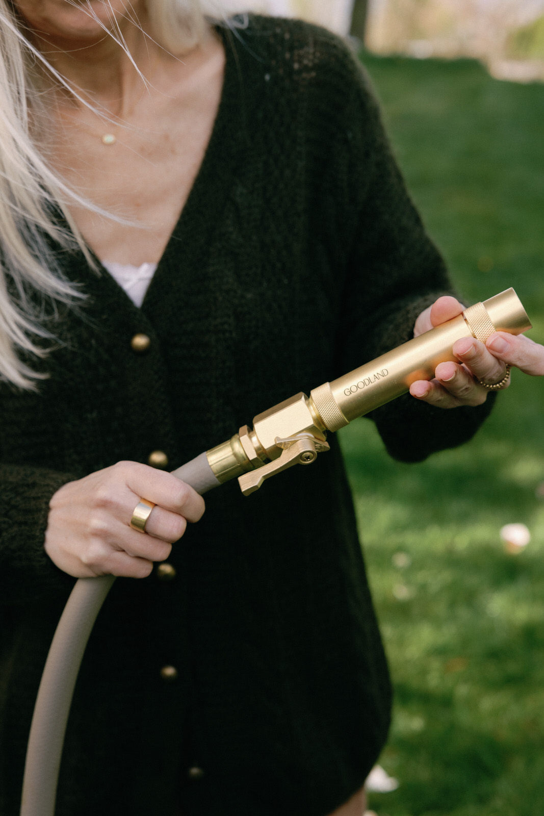 Brass shut off valve and nozzle for garden hoses with adjustable spray 