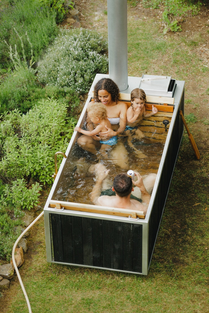 rectangular hot tub with small family  