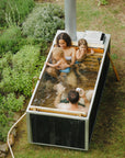 rectangular hot tub with small family  