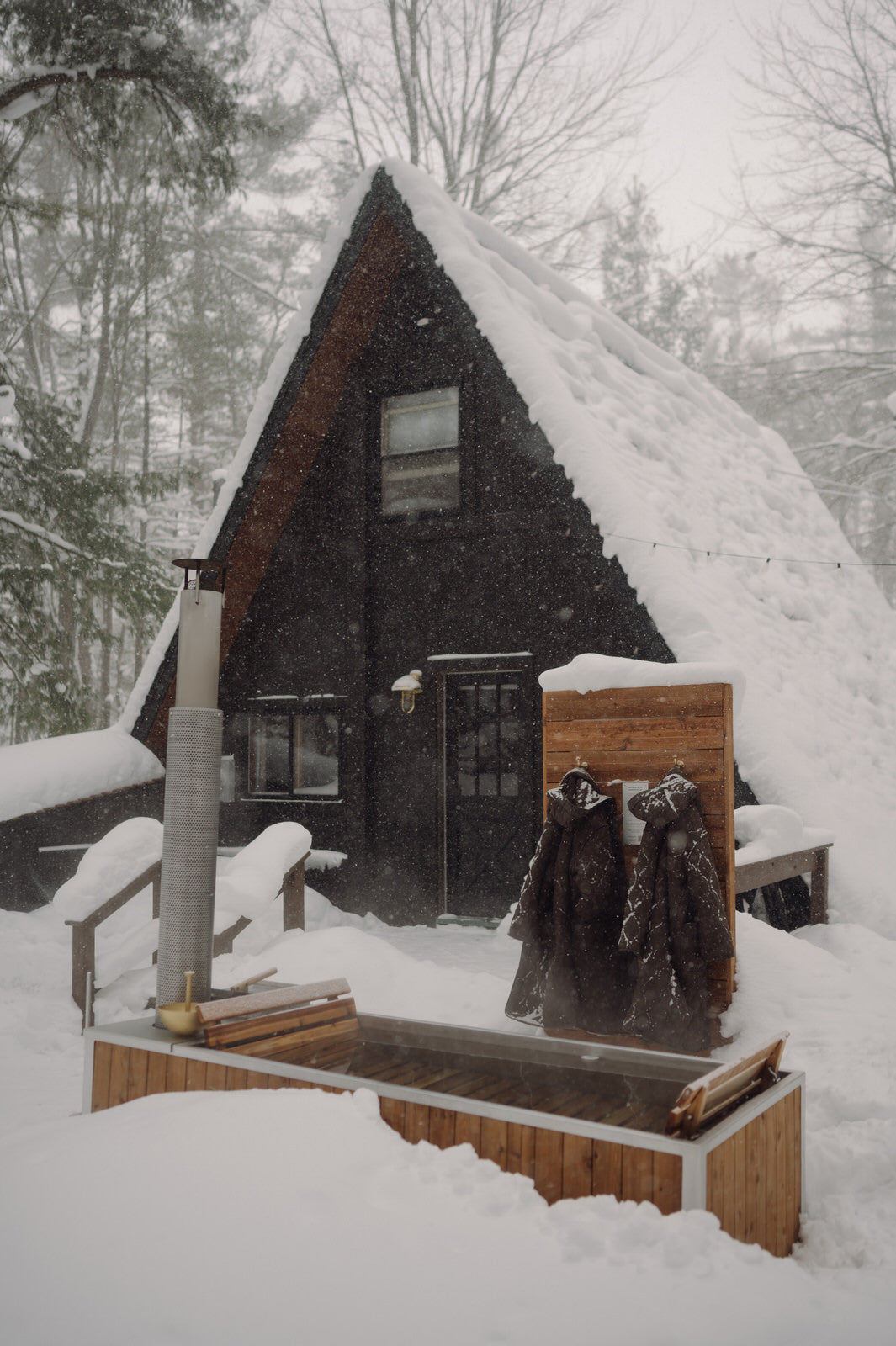 winter wood burning hot tub in the snow