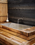 Outdoor soaking tub built in wood deck with stainless steel liner