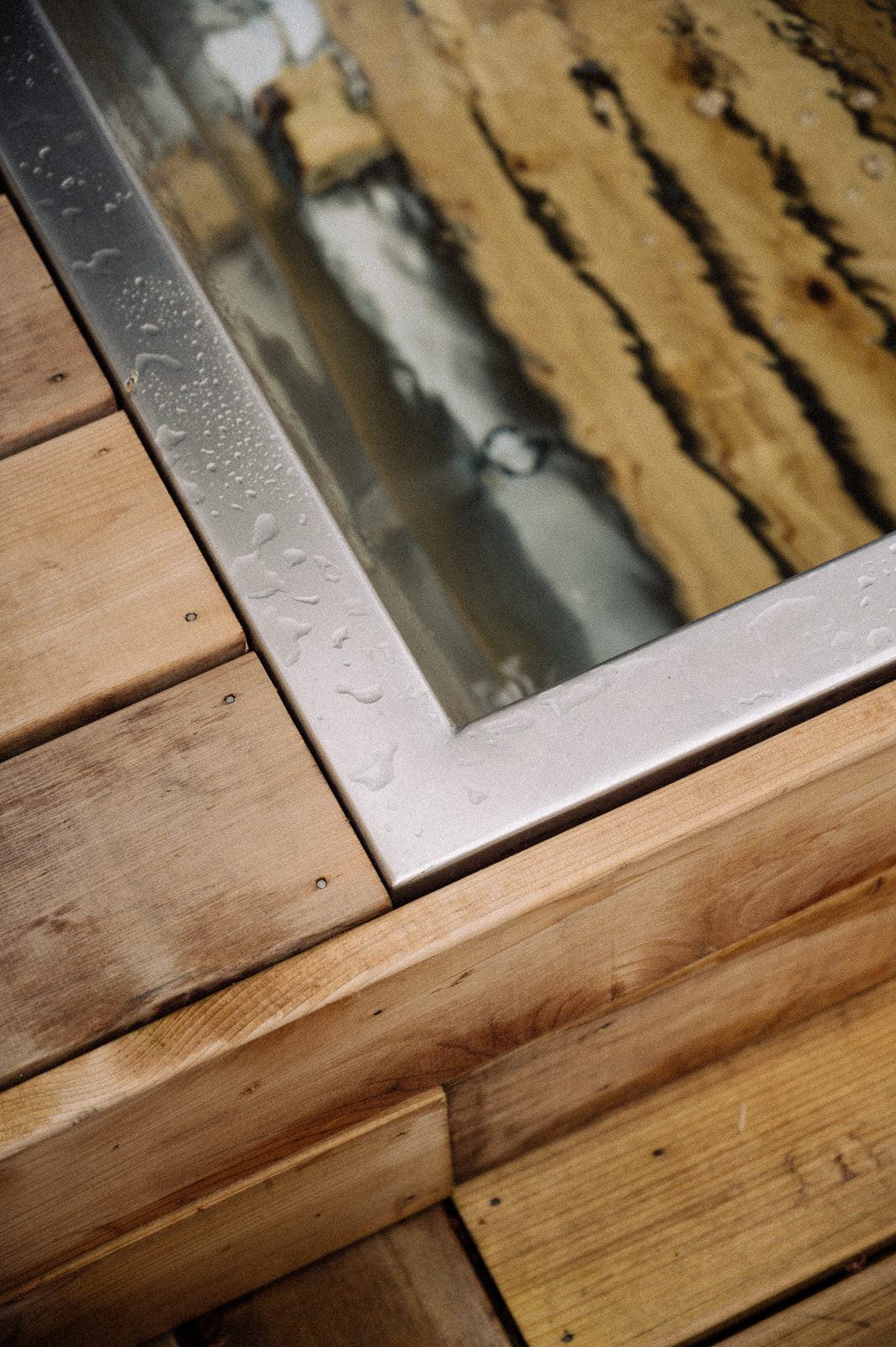 Stainless steel outdoor drop in soaking tub close up