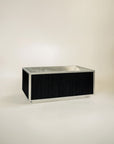free standing tub made from stainless steel and black wood exterior 
