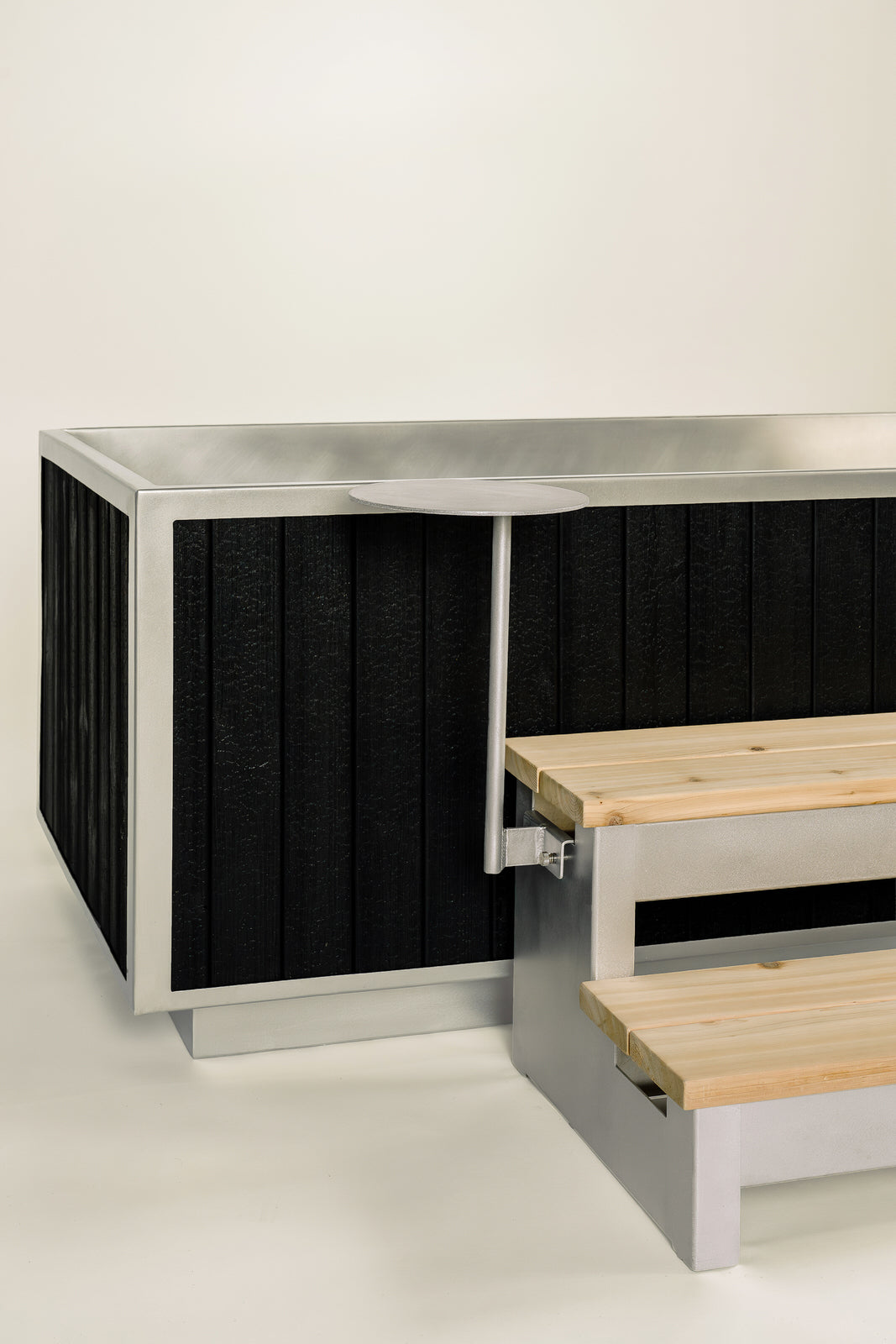 black wood outdoor soaking tub with cedar steps
