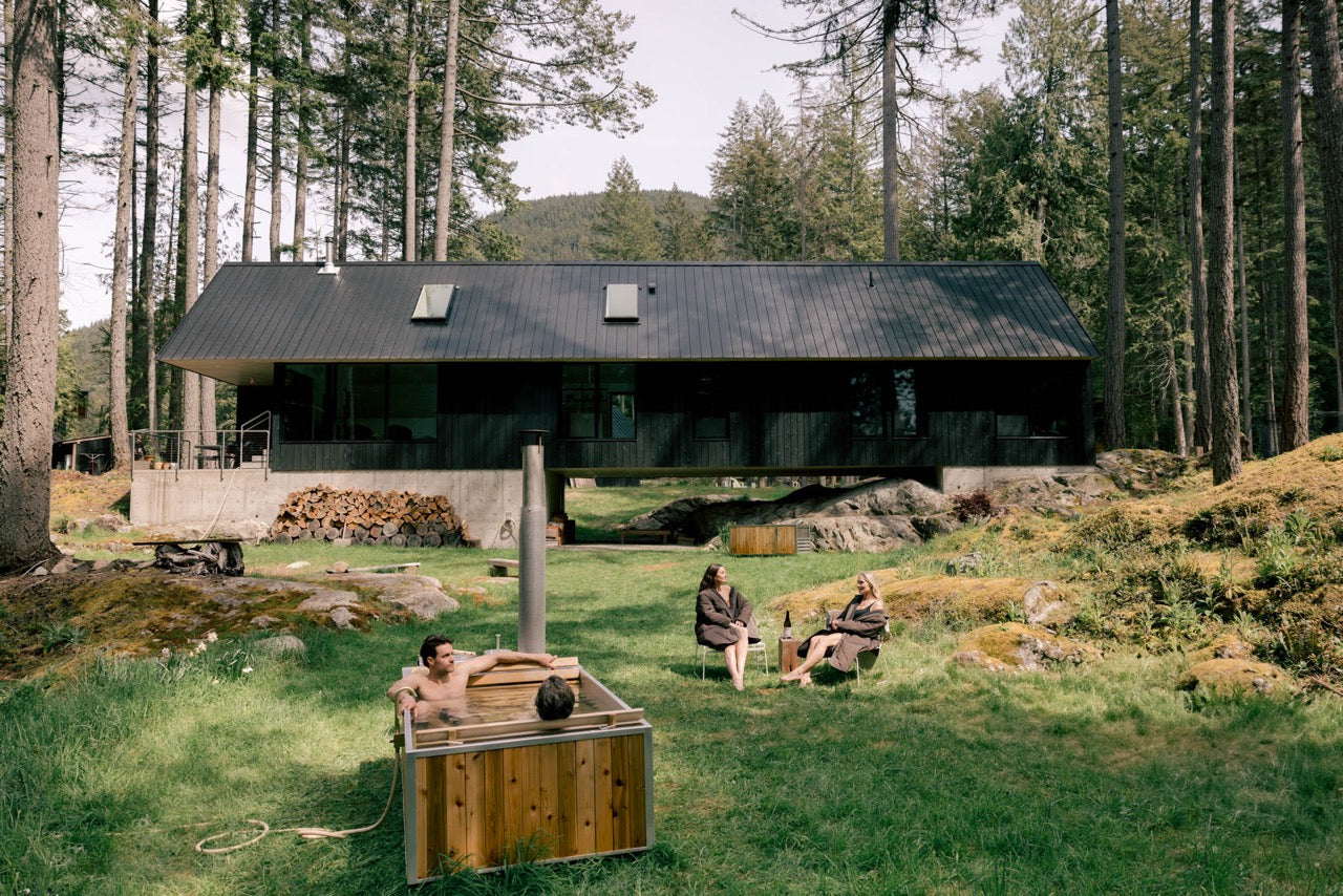 hot tub wood fired with people lounging 