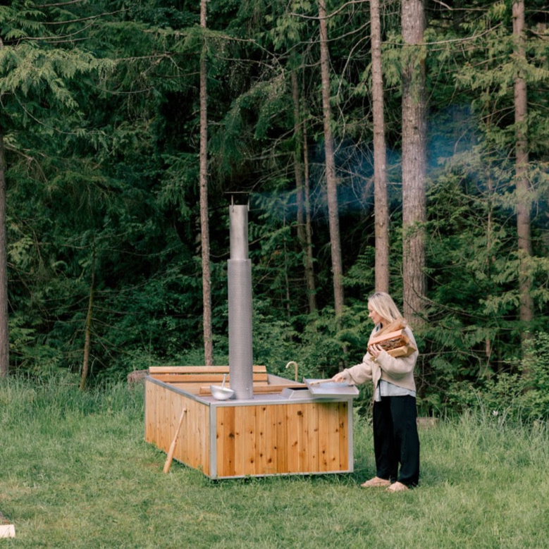 wood heated hot tub - adding wood to stove