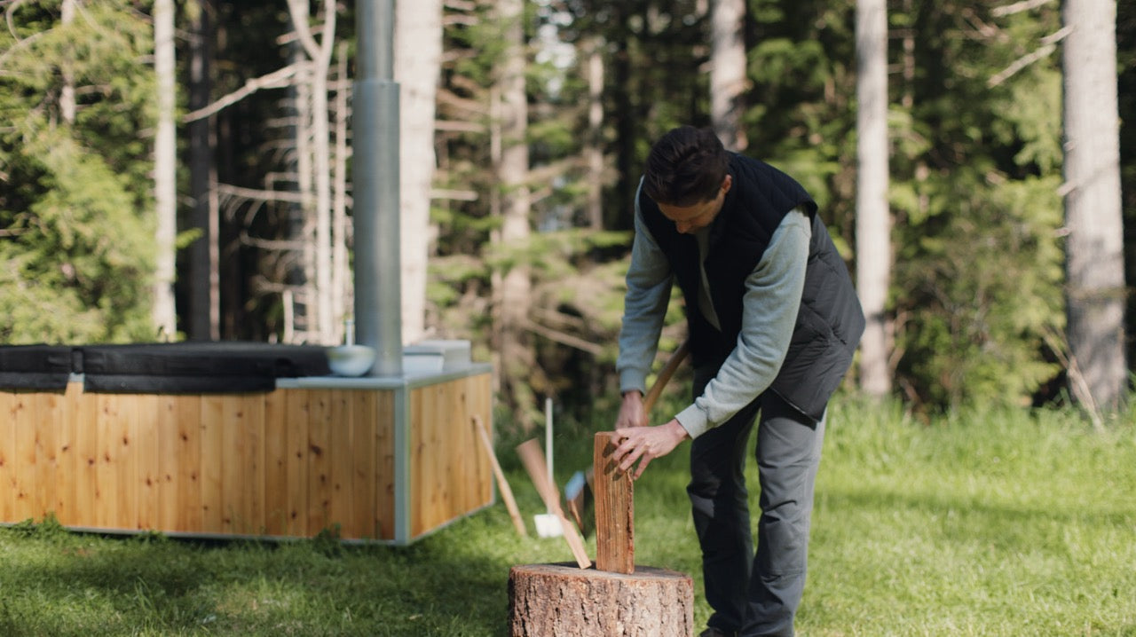 chopping firewood for hot tub fire