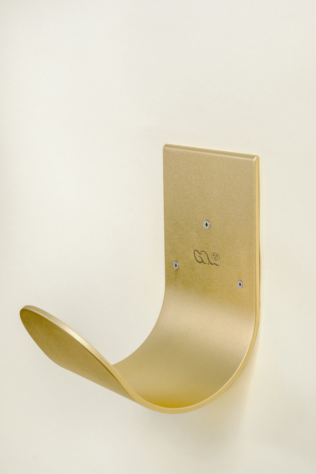 Wall mounted hose hanger in brass for garden hose #color_raw_brass