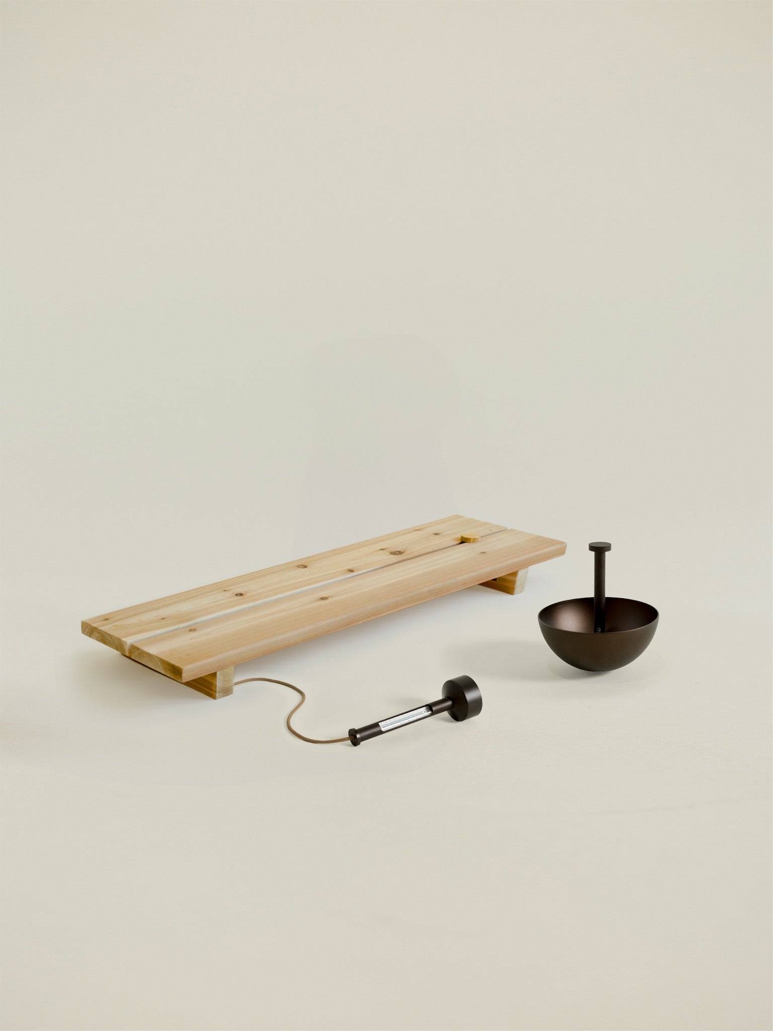 bathing essentials kit includes a wood bath tray, floating thermometer, and hand shower