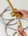 Brass faucet attaches to garden hose