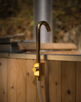 Hot tub filler brass faucet attached to a garden hose