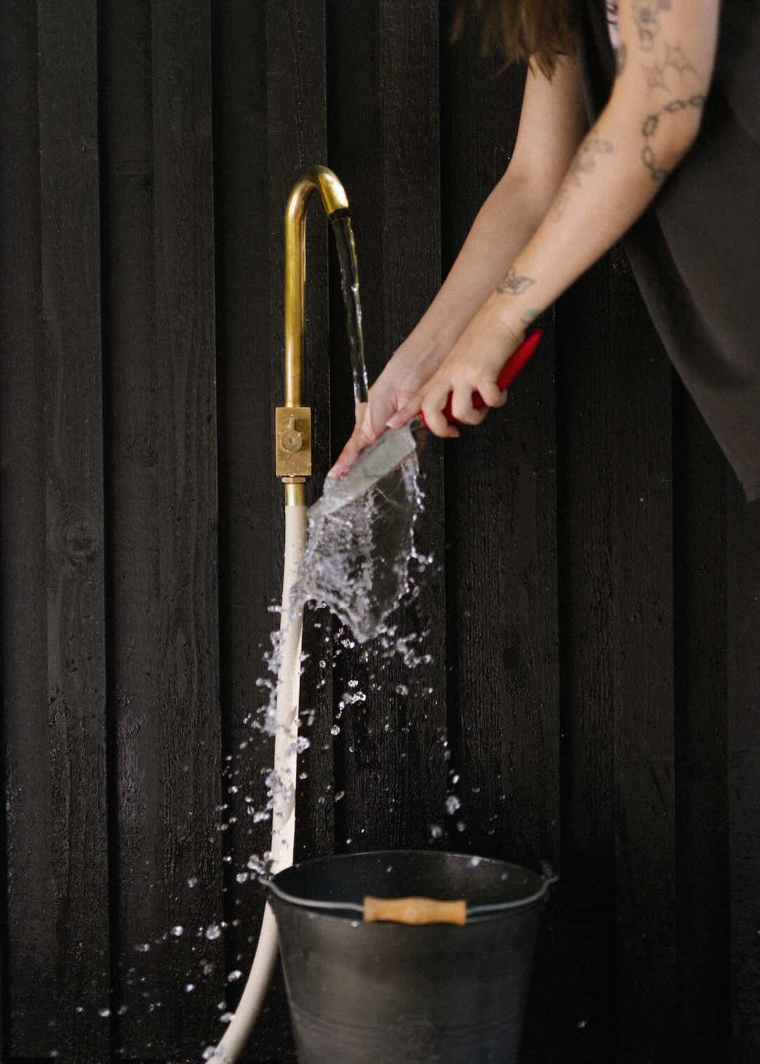 Garden hose attached to brass faucet