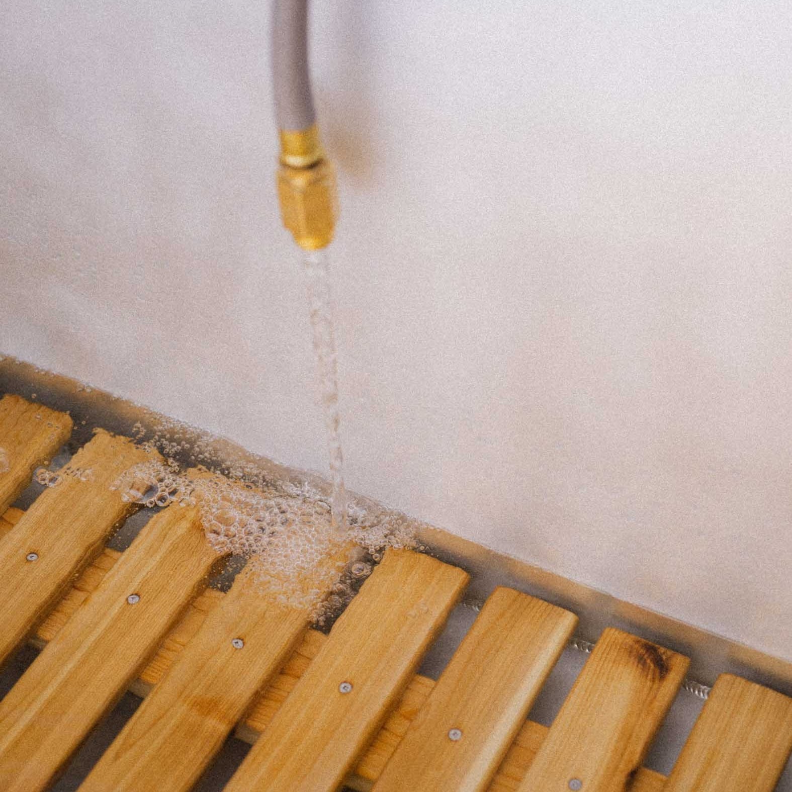 filling the soaking tub with a garden hose