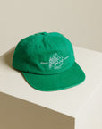 Green baseball hat from GOODLAND with illustration from Canaan Pine