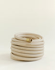 Luxury tan coiled garden hose