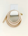 Modern metal hose holder with garden hose 