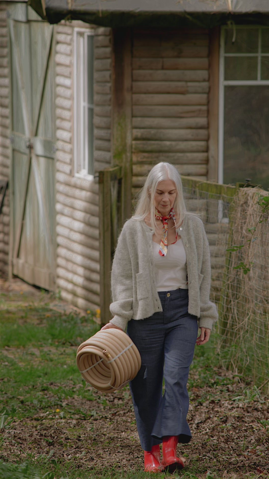 woman with beige garden hose