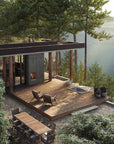 soaking tub built in wood deck of modern home set in nature