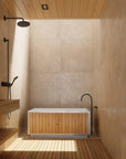 freestanding tub in a modern integrated bathing zone or wet room 